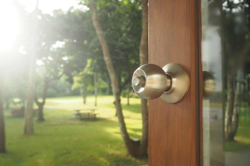 a door knob on a storm door