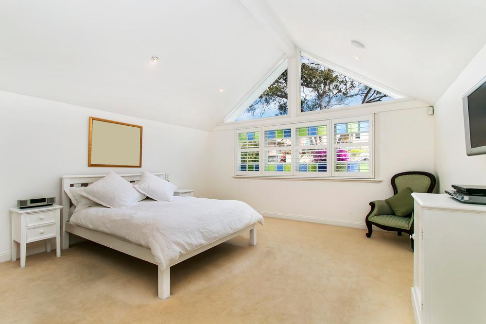 a bedroom with stained glass windows